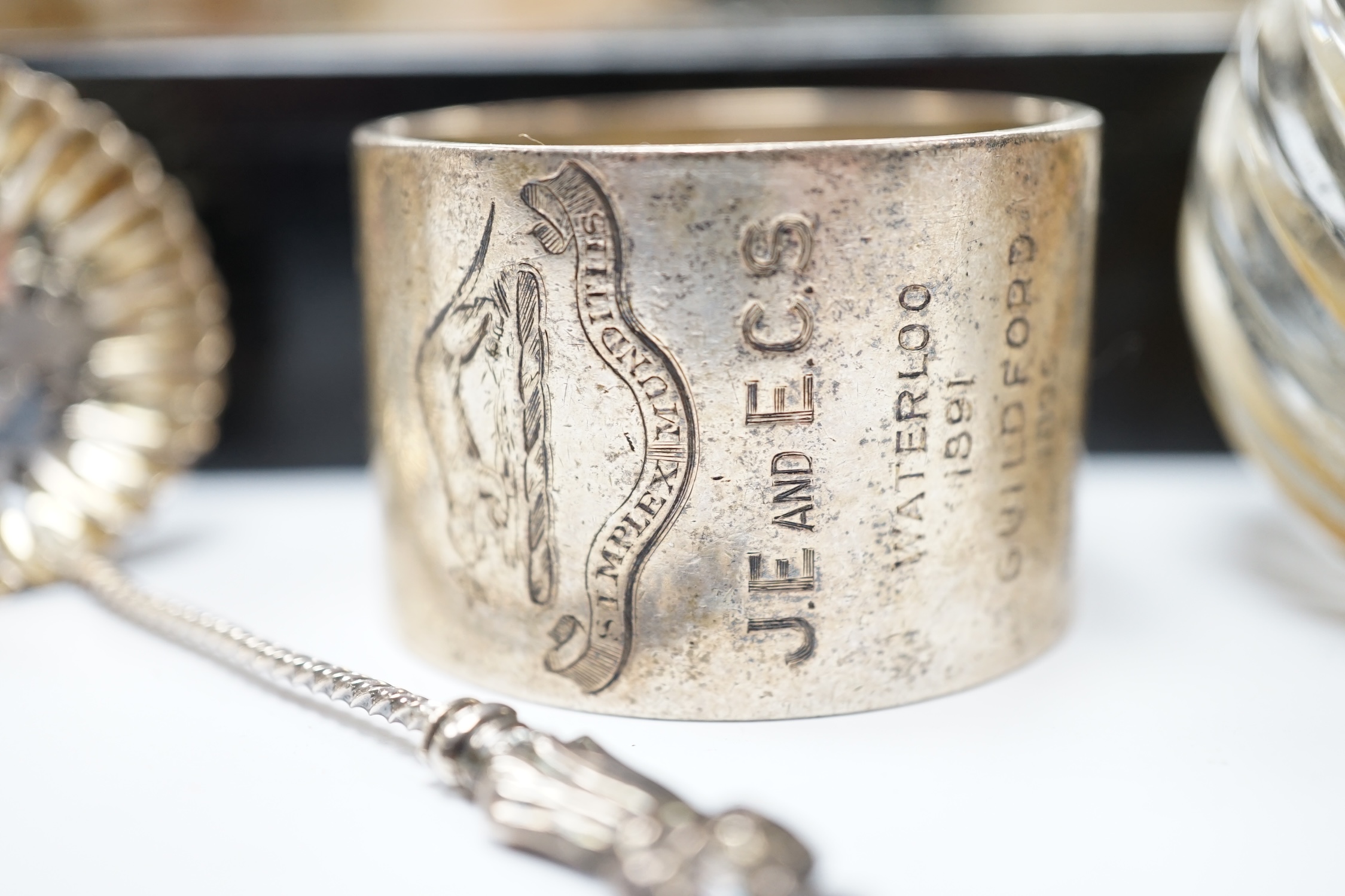 Four assorted silver mounted glass toilet jars, an Edwardian silver mounted glass mustard jar with spoon, a silver napkin ring, sifter spoon and ebony box. Condition - poor to fair